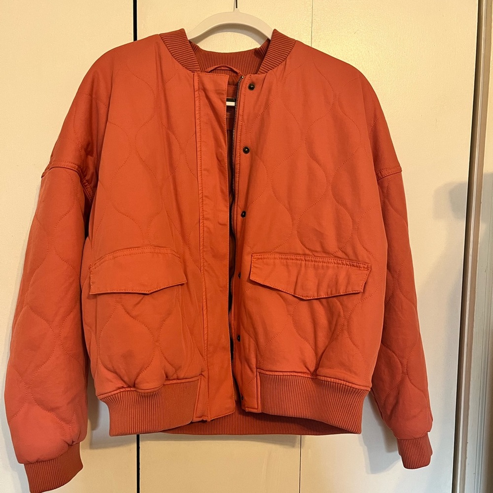 Pink quilted bomber jacket
